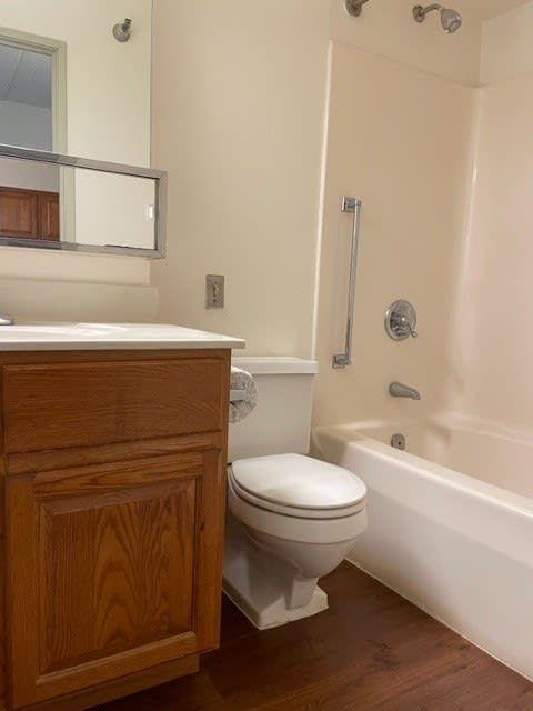a bathroom with a toilet sink and bathtub