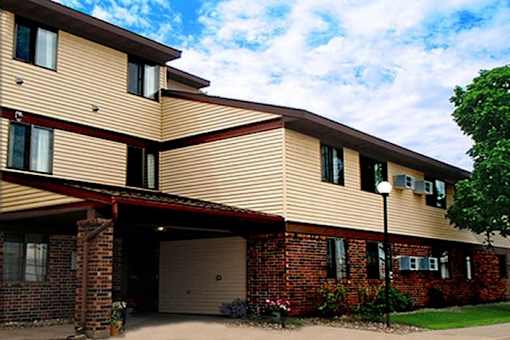 A two-story residential building with a garage.