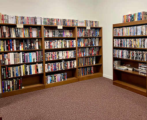 A room filled with bookshelves containing a variety of books.