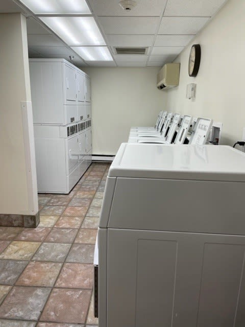 a laundromat with a bunch of machines in it