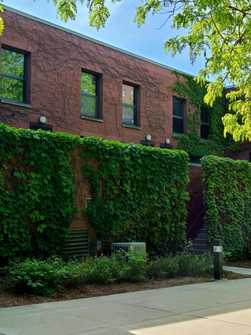 a red brick building covered in ivy