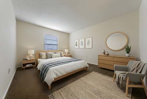 A bedroom with a bed, nightstand, chair, and a plant. at Hunt Club Apartments, Apartments, Copley, OH