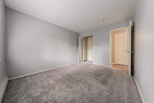 A room with grey carpet and white walls. at Integrity Berea Apartments, Ohio