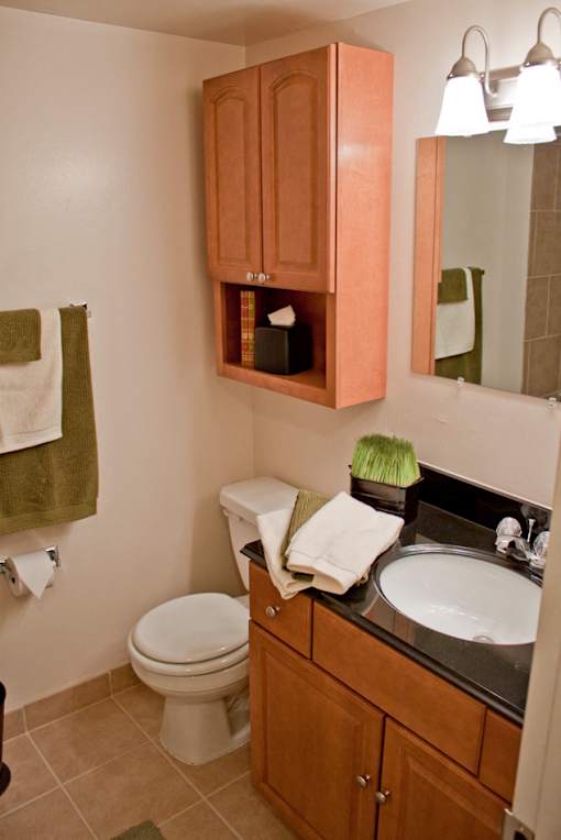Bathroom Cherry finish cabinetry at Westwood Meadows - SP Westlake 27825 Detroit Apartments, Integrity Realty LLC, Westlake, Ohio