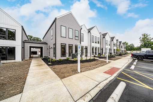 A row of modern houses with a truck parked in the driveway at Westwood Meadows, Westlake, OH, 44145