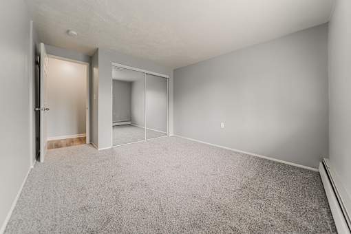 A room with a carpeted floor and a doorway leading to another room. at Integrity Berea Apartments, Ohio