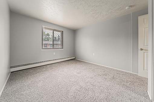 A room with a carpeted floor and a window. at Integrity Berea Apartments, Ohio, 44017