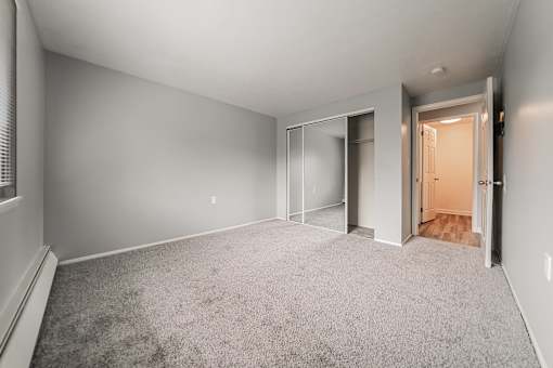 A room with grey carpet and white walls. at Integrity Berea Apartments, Berea, OH, 44017