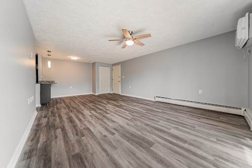 A room with a ceiling fan and wood flooring. at Integrity Berea Apartments, Apartments, Berea, OH