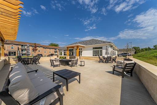 A sunny day at the outdoor seating area of a residential building..