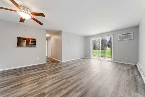 Living room with a ceiling fan and wood flooring at Integrity Chardon Apartments, Chardon,  Ohio