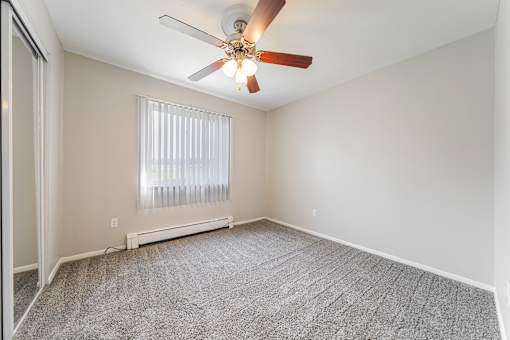 Bedroom with a ceiling fan at Integrity Chardon Apartments,Ohio