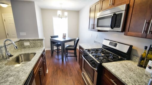 Townhome dining and kitchen area featuring dark cherry wood.