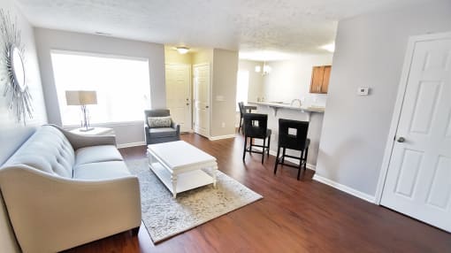 Townhome living and kitchen areas with breakfast bar.
