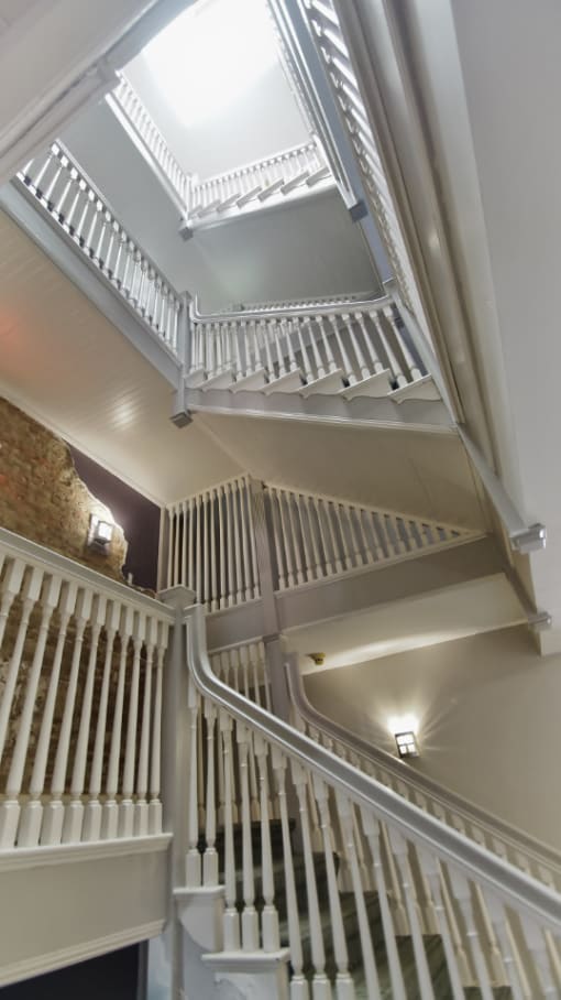 Original Staircase in the Common Area at Tremont Terraces Apartments in Cleveland, Integrity Realty LLC