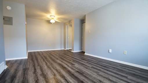 A room with wooden flooring and a light on the ceiling. at Integrity Berea Apartments, Berea, Ohio
