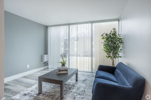 Living room with plank flooring at Eagles Landing Apartments, Integrity Realty, Ohio