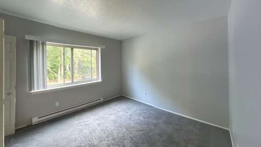 Spacious carpeted bedroom at Jordan Court Apartments, Integrity Realty, 44240