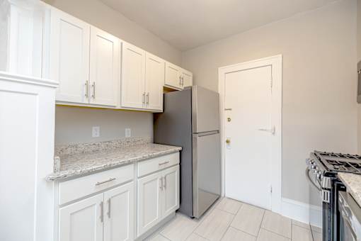 White Cabinets In Kitchen at Heights Collection Apartments, Cleveland Heights