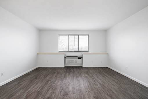 A room with a window and a wooden floor at Integrity Medina Apartments, Medina, OH,  44256