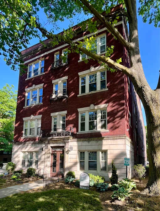A red brick building with a tree in front. at Integrity Cleveland Heights Apartments, Cleveland Heights, 44106