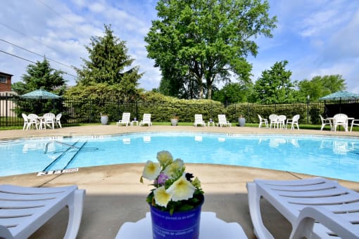 Pool with Lounge Chairs at River Run Apartments, Warren, OH, 44485