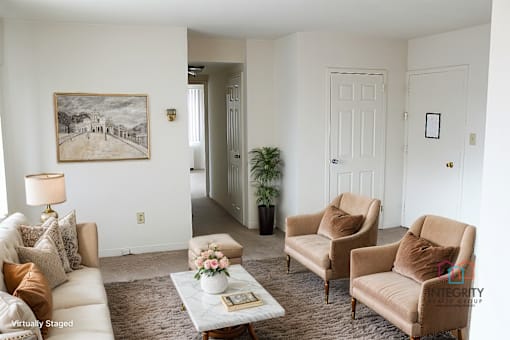 A living room with a white couch, two chairs, and a coffee table Integrity Realty, 44120