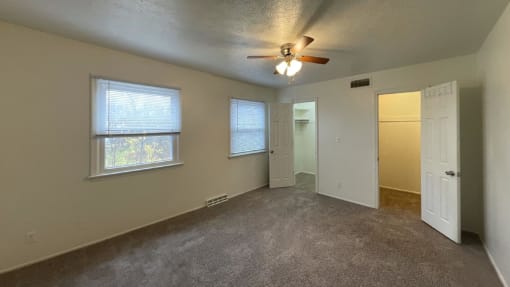 Large bedrooms with ceiling fan at Woodland Pointe Apartments and Townhomes, Integrity Realty, Kent, OHs