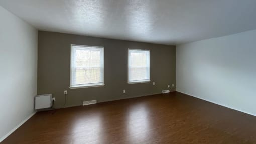 Spacious living room with plank at Woodland Pointe Apartments and Townhomes, Integrity Realty, Kent, OH style floors