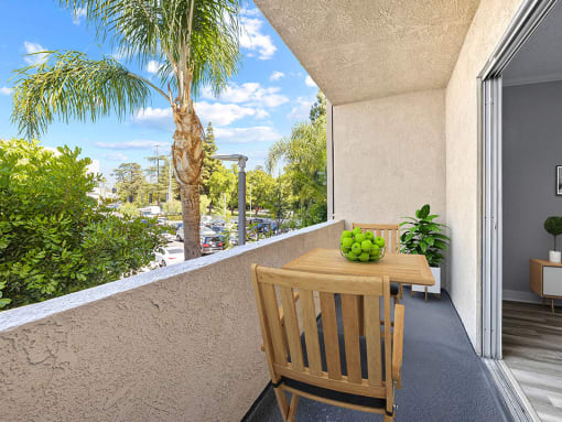 Large balcony with seating space and view of neighborhood of Chandler Circle Apartments.
