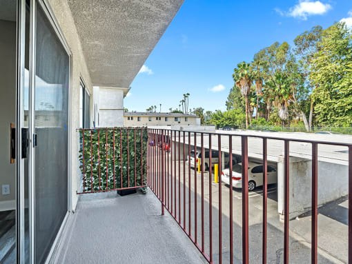 Private balcony overlooking covered parking area.