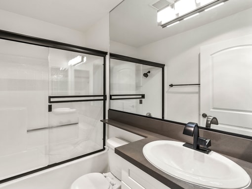 Modern styled bathroom with shower and tub.