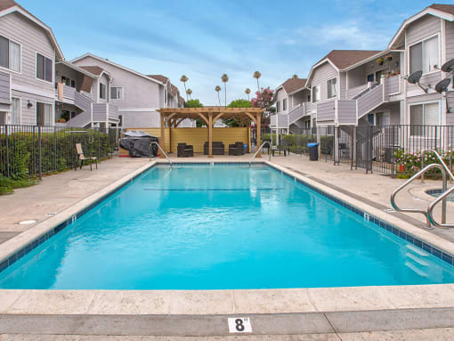 Large courtyard swimming pool, including jacuzzi and lounging area.