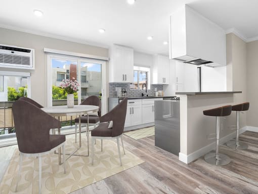Hardwood floored dining room near bar seating in kitchen.