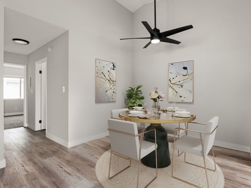 Hardwood floored dining room with view of second bedroom.