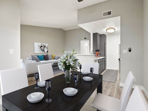 Hardwood floored dining room with view of living room.