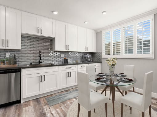Hardwood floored dining room with view of gorgeous tiled kitchen.