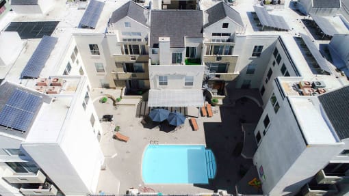 Drone image of the pool and roofs with white solar coating to lower our carbon footprint.