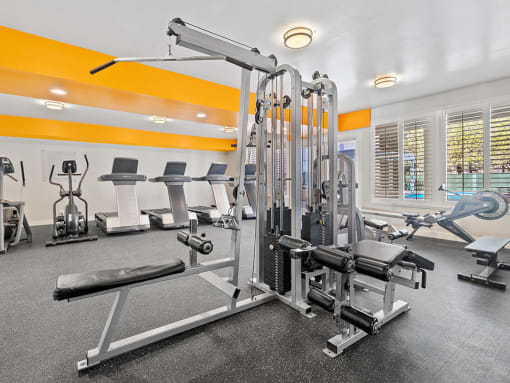Community workout room with bikes, treadmills, and weight equipment