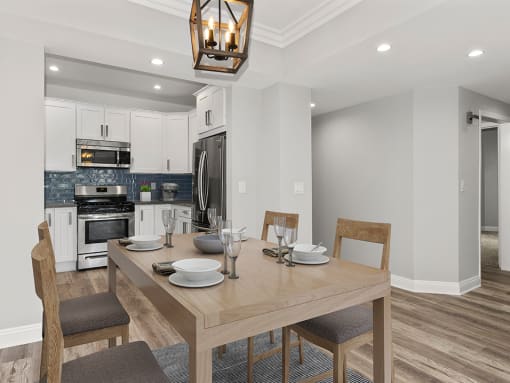 Hardwood floored dining room with view of kitchen.