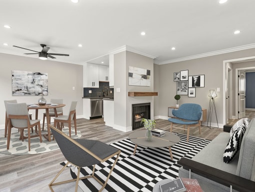 Living room with hardwood floors and view of dining room and kitchen.