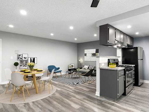 Hardwood floor living room and dining room with view of kitchen.
