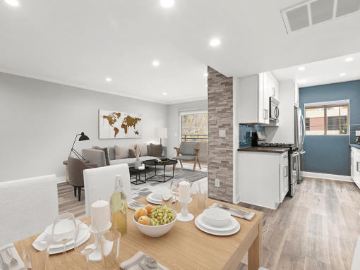 Hardwood floored dining room with view of living room and kitchen.
