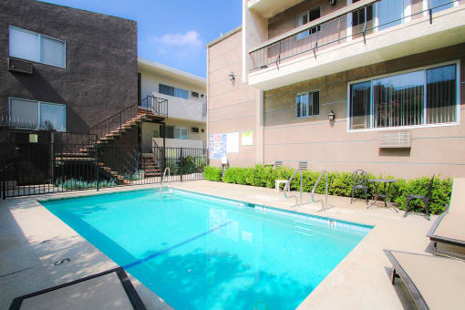 Beautiful courtyard pool with lounging space.
