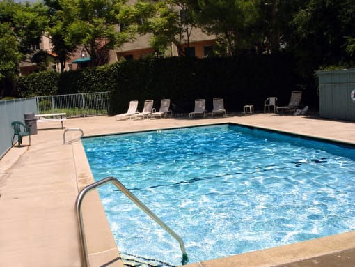 Beautiful community pool with lounging area.