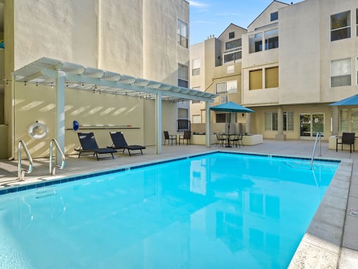 Courtyard pool with lounging and picnic space