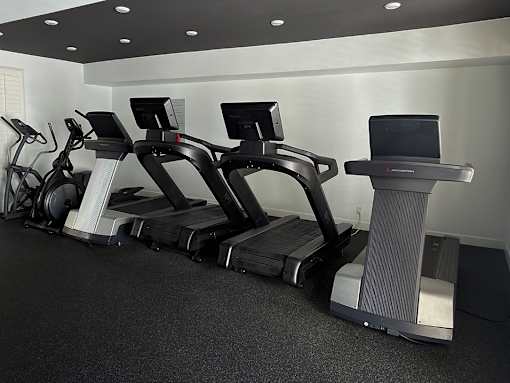 Fitness Center with Treadmills and Free Weights.