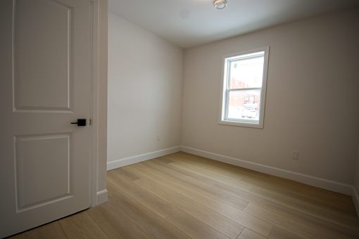 A room with a door and a window.