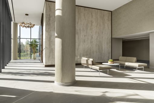 Interior photo of the entry floor lobby showing spacious area with luxury seating