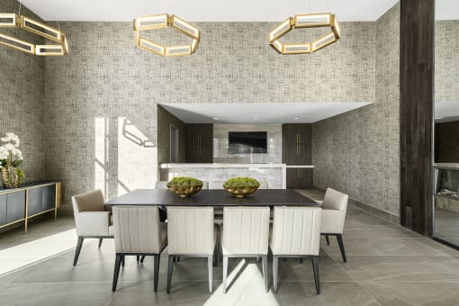 Interior photo of the reservable private dining area, complete with large table with seating for 10, and private kitchen area.